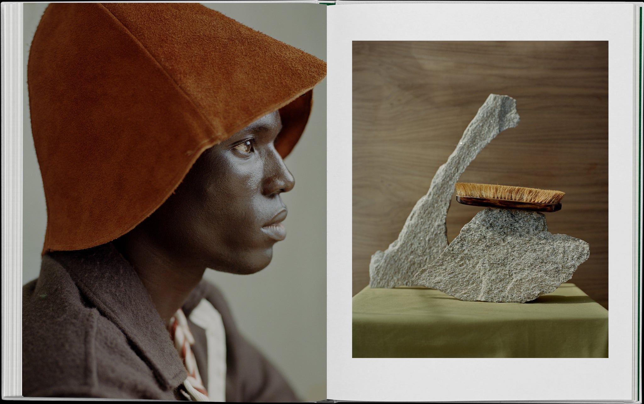 Book layout. Left: Profile of a man with a suede hat.    Right: A still life image of a green table cloth with two stones upon it and a brush balancing on the stone. 